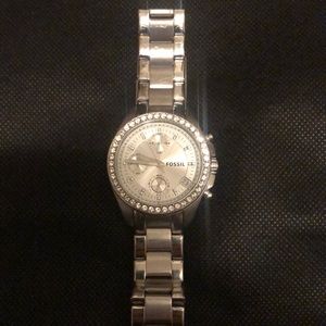 Fossil stainless steel chronograph watch with diamond bezel and date.